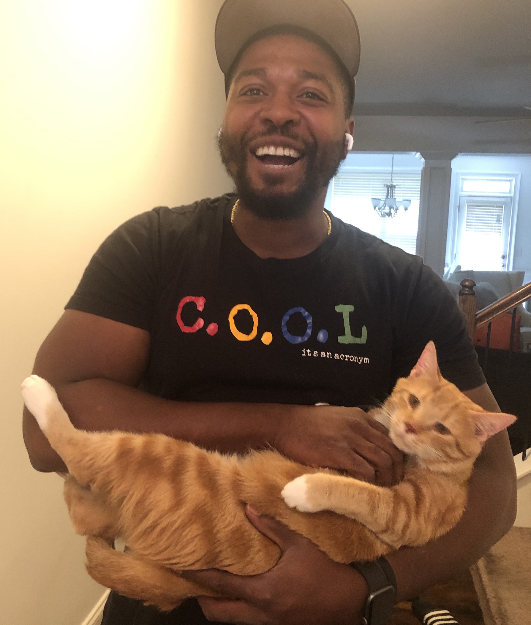 man holding his cat